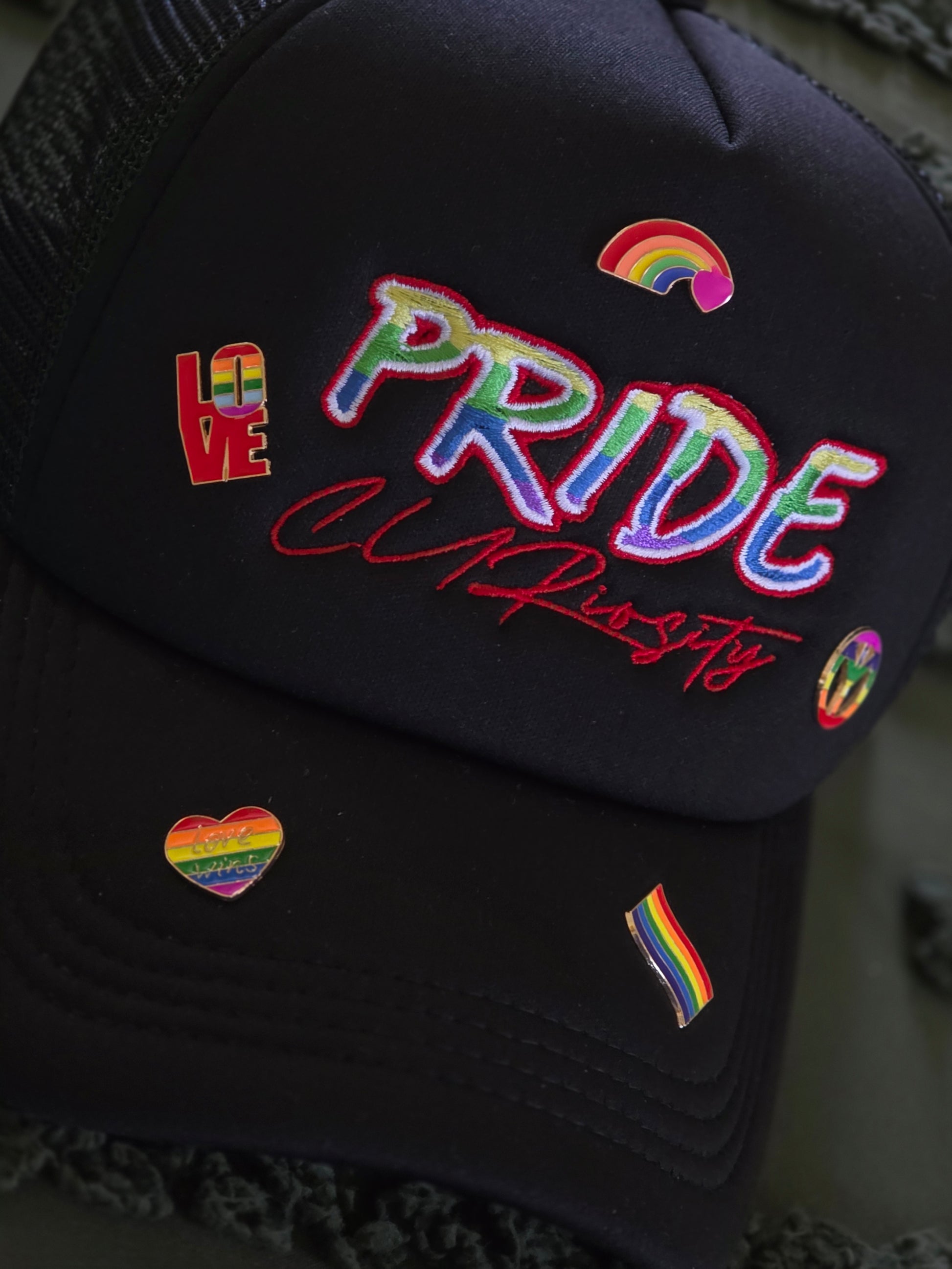 Pride Curiosity Trucker Hat - Black w/Pride Pins